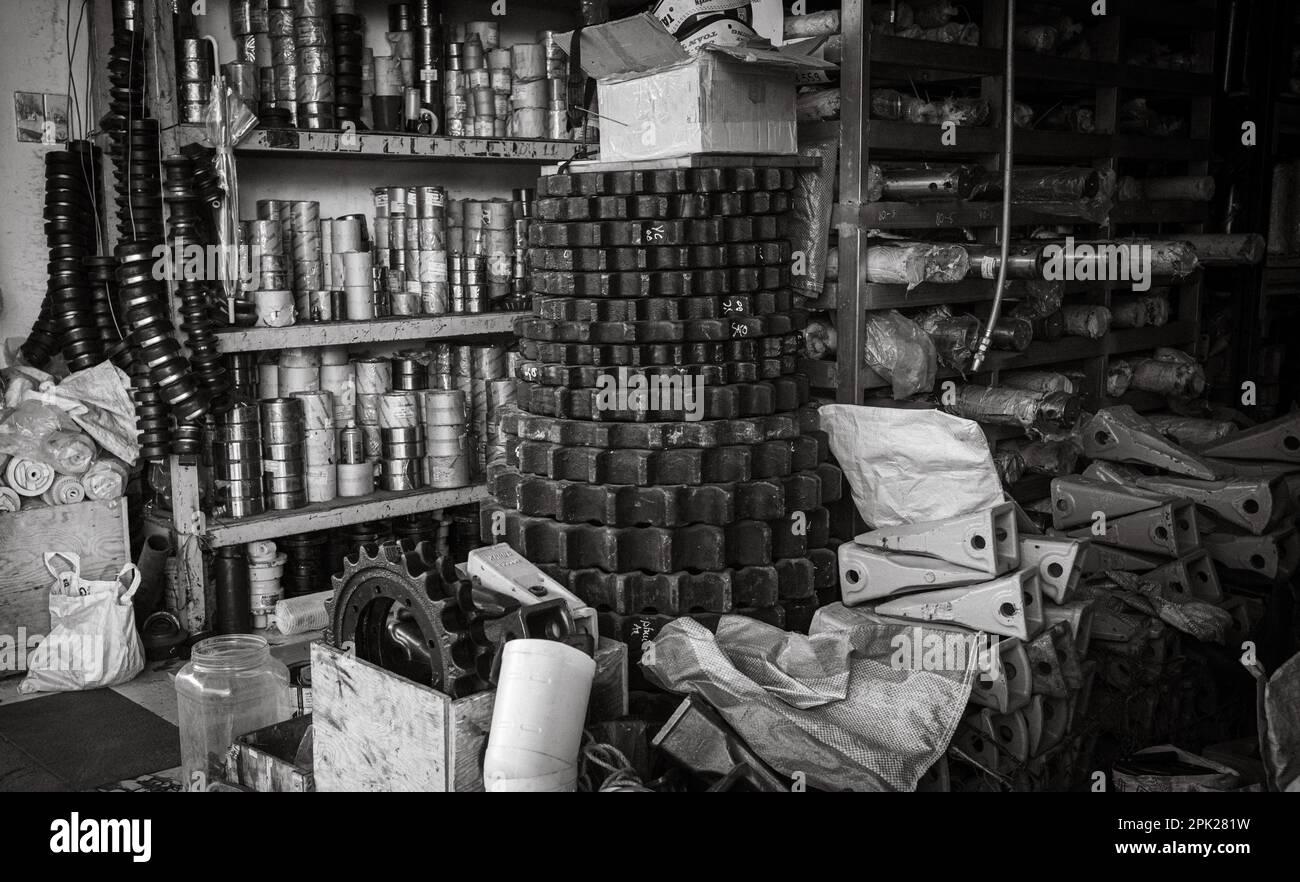 A shop at the central market in Pleiku, Vietnam, selling heavy steel cogs and other engineering equipment. Stock Photo