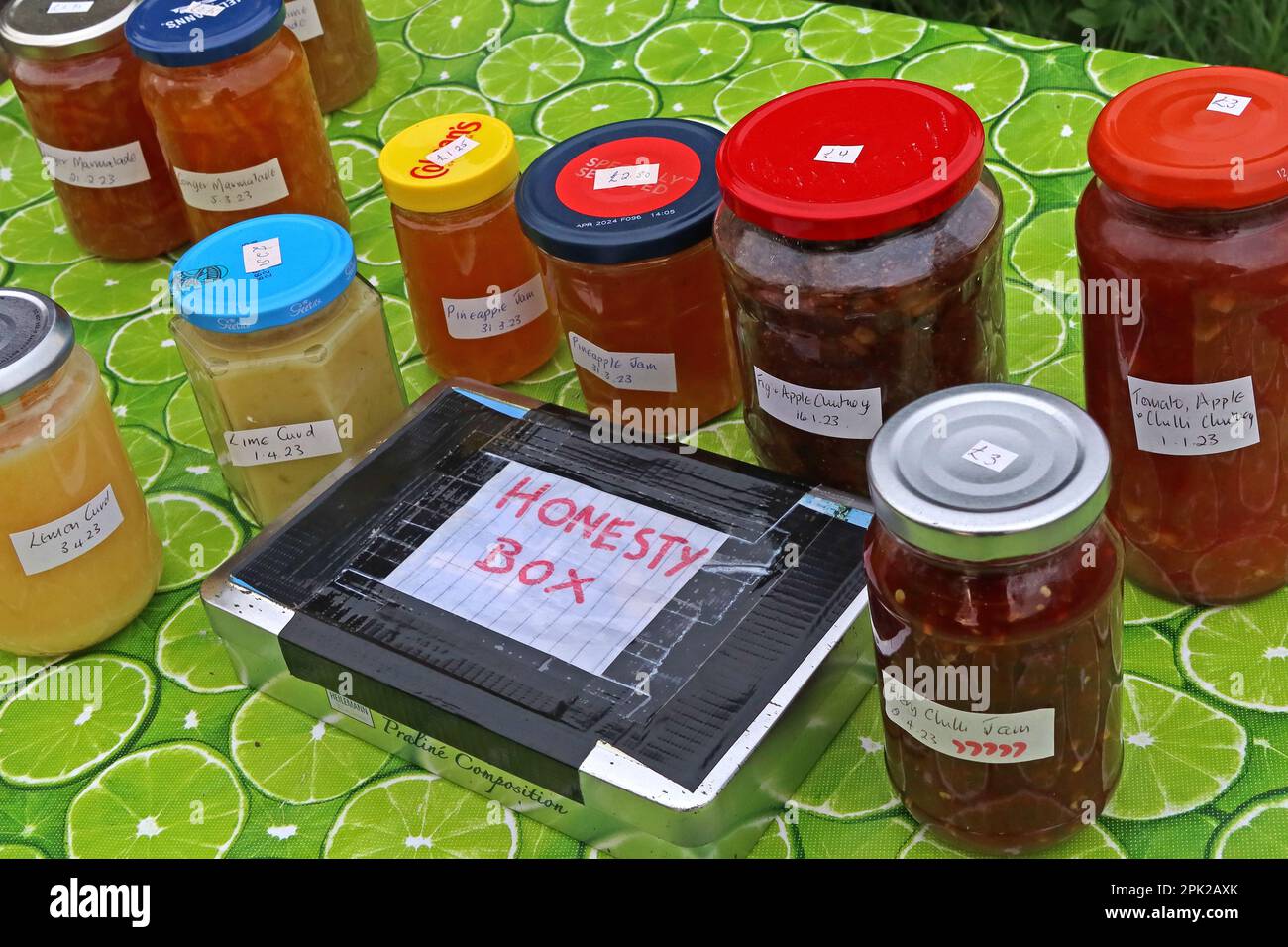 Homemade preserves for sale - Charity jam and chutney Honesty box, Warrington, Cheshire, England, UK, WA4 Stock Photo