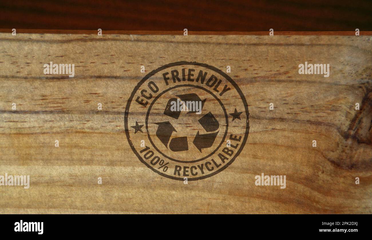 Eco friendly recycling stamp printed on wooden box. Environment ecology and sustainable business concept. Stock Photo
