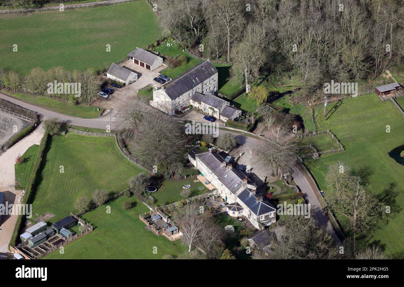 aerial view of some stone built houses, including The Mill House former