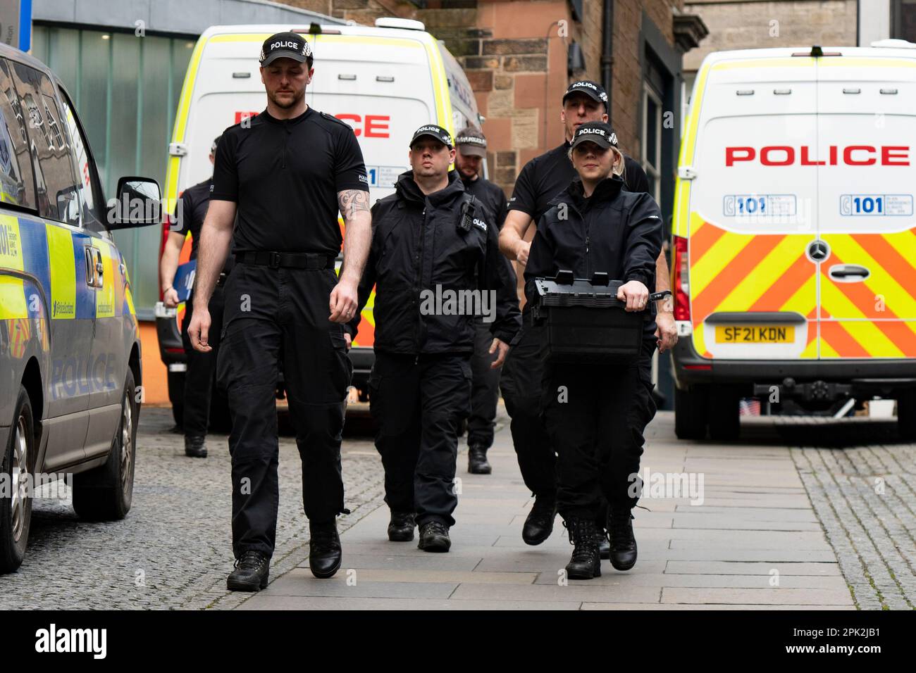 Edinburgh, Scotland, UK. 5 April 2023. Police enter office building