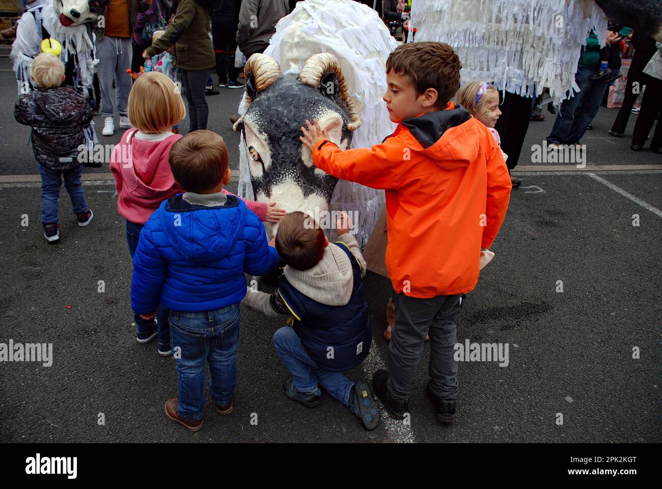 Adulation of the giant Swaledale sheep by children attending the Skipton Puppet festival (approximately 2015 in North Yorkshire, UK) Stock Photo