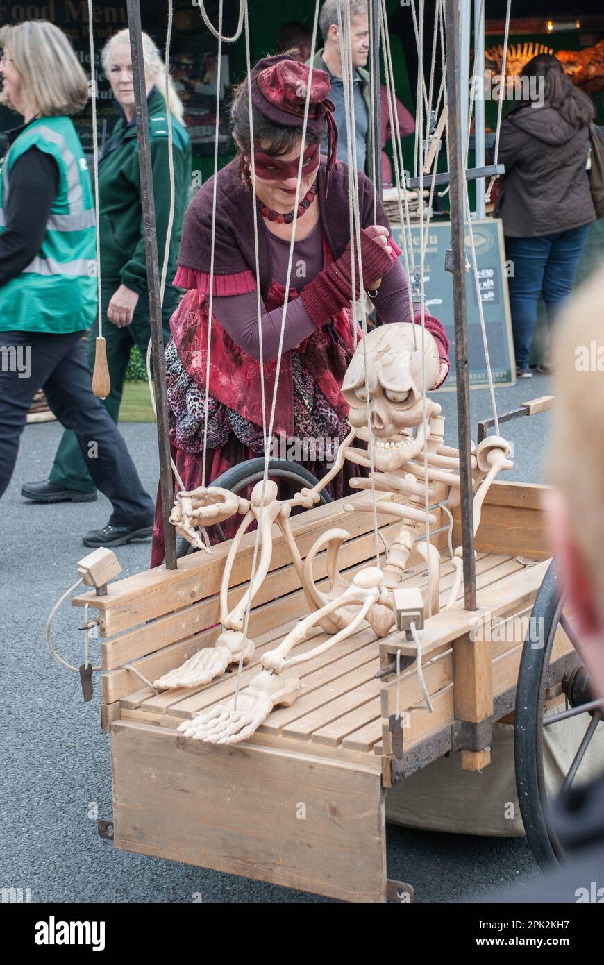 Stringed skeleton puppet on a cart waiting to come to life....seen at the Skipton International Puppet Festival, North Yorkshire, UK. Stock Photo