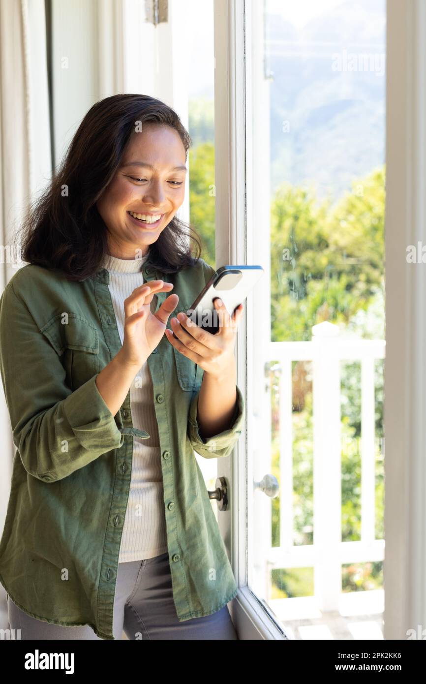 Happy pretty asian woman using hi-res stock photography and images - Alamy