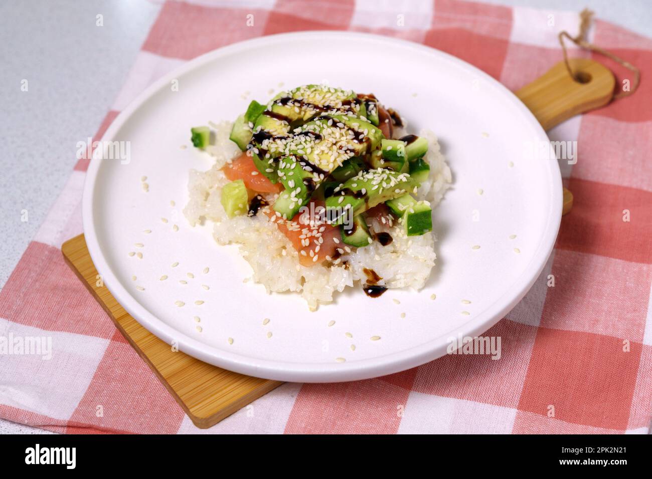 Sushi Waffle is crispy rice, made in a waffle maker, topped with shoyu