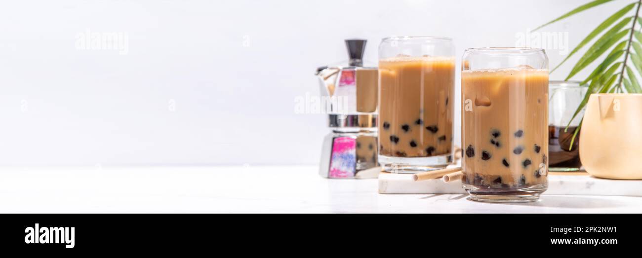 Iced tapioca coffee latte or boba pearl bubbles milk tea, asian trendy cold coffee drink with