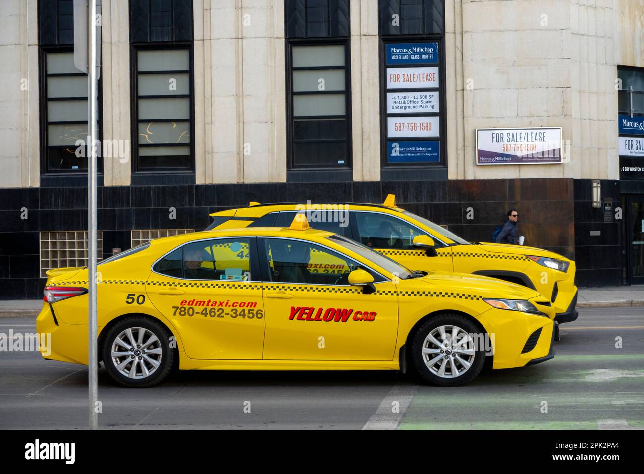 Edmonton, Alberta, Canada. Apr 04, 2023. Yellow Taxis vehicles in Downtown Edmonton. Stock Photo