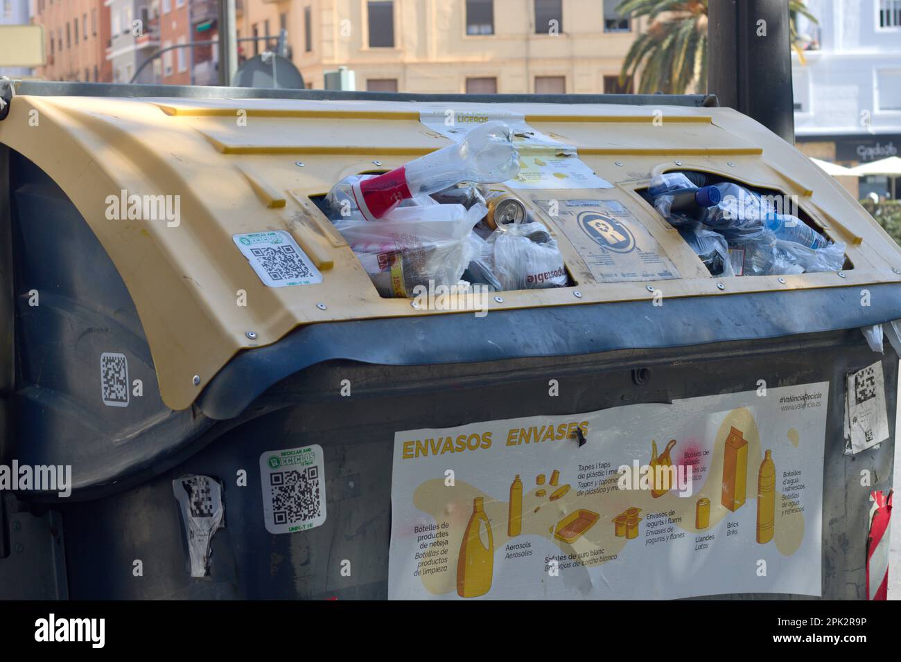2023. Valencia, Spain. Closeup of a yellow container where citizens throw away plastic waste