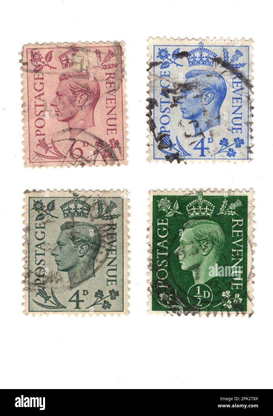 Vintage King VI postage stamps from the United Kingdom isolated
