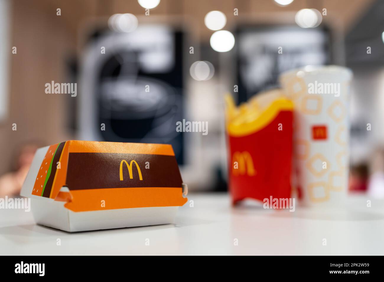 Big Mac Box with McDonald's logo, french fries and soft drink on table in McDonald's Restaurant. Selective focus. Minsk, Belarus, 2023 Stock Photo