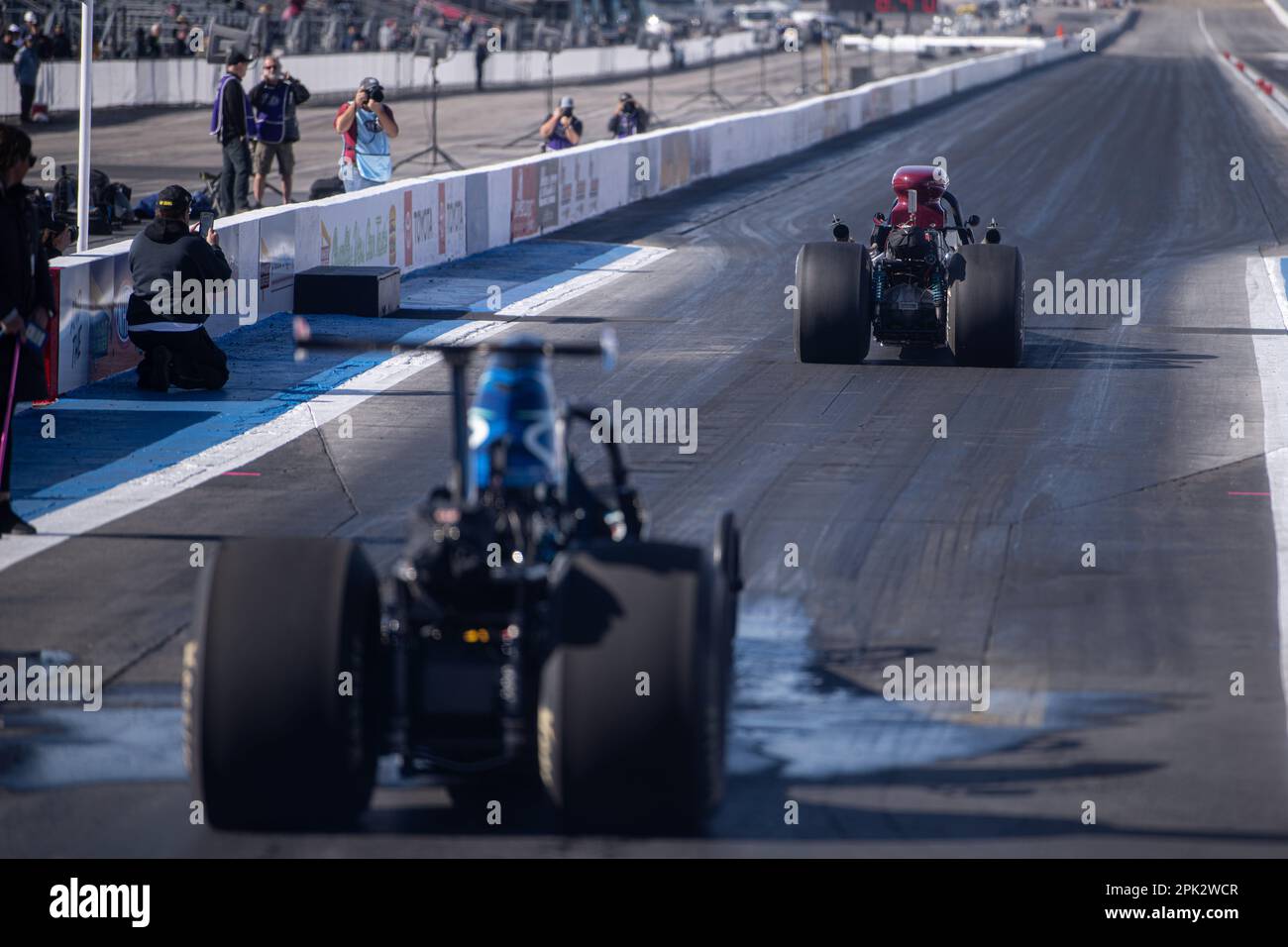 Pomona, United States. 31st Mar, 2023. Drivers from the Lucas Oil Wintrernational stage do practice runs before the days competition. Professional Drag racers nationwide rally together to compete at the Lucas Oil NHRA Winternationals held at the In-N-Out Burger Pomona Dragstrip for the 63rd consecutive year. Drivers battled over a three-day period starting on March 31st and concluding on April 2, fighting to take the titles in each of their divisions. Credit: SOPA Images Limited/Alamy Live News Stock Photo