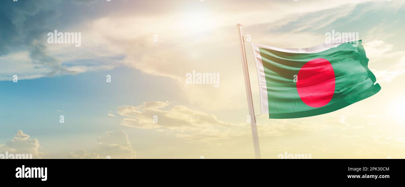 Bangladesh national flag waving in beautiful sky. 3d waving flag of bangladesh flag. Happy independence day of bangladesh. Stock Photo
