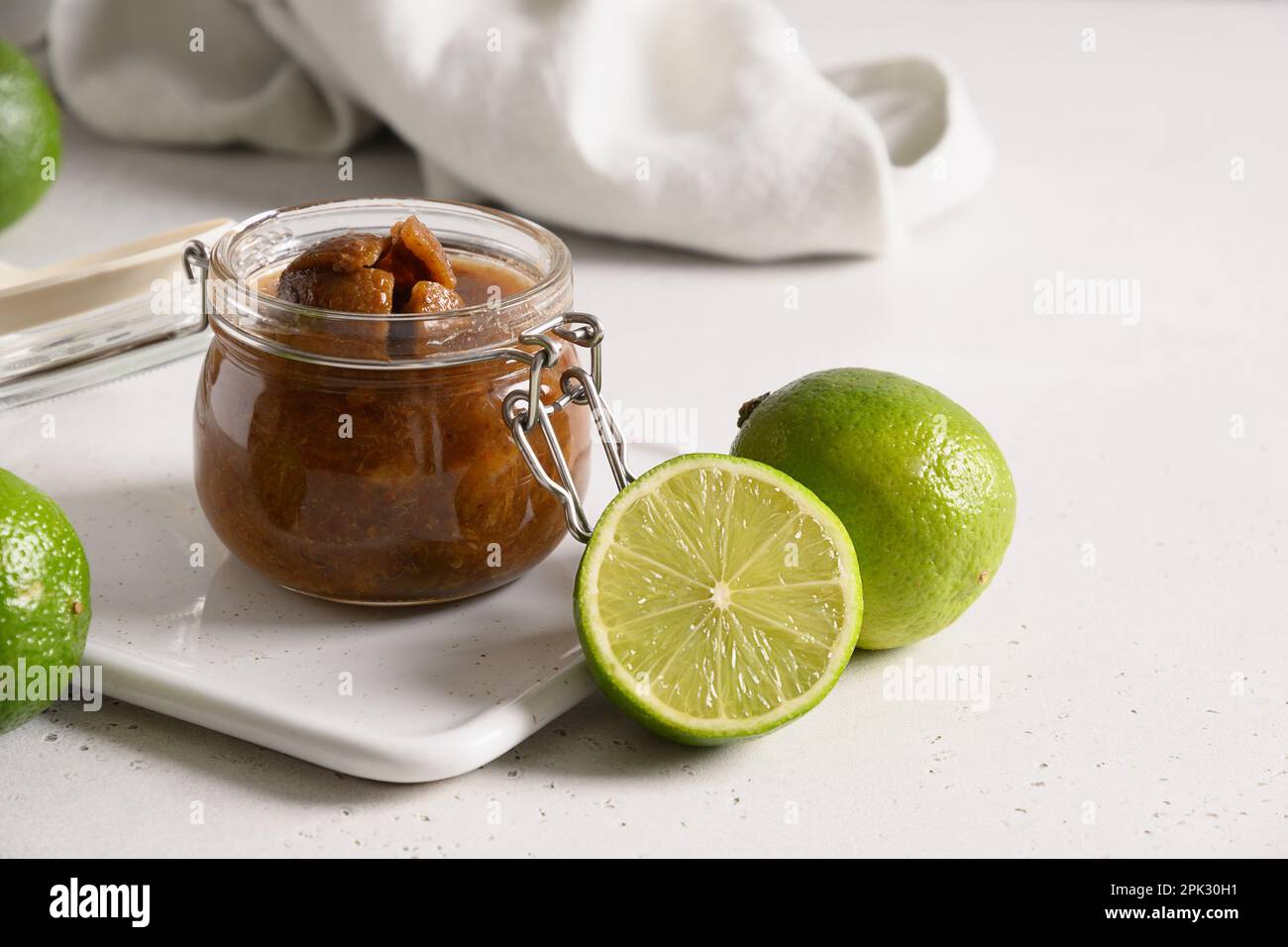 Sri Lankan Lime Pickle of lime, salt, chilli, pepper in glass preserve