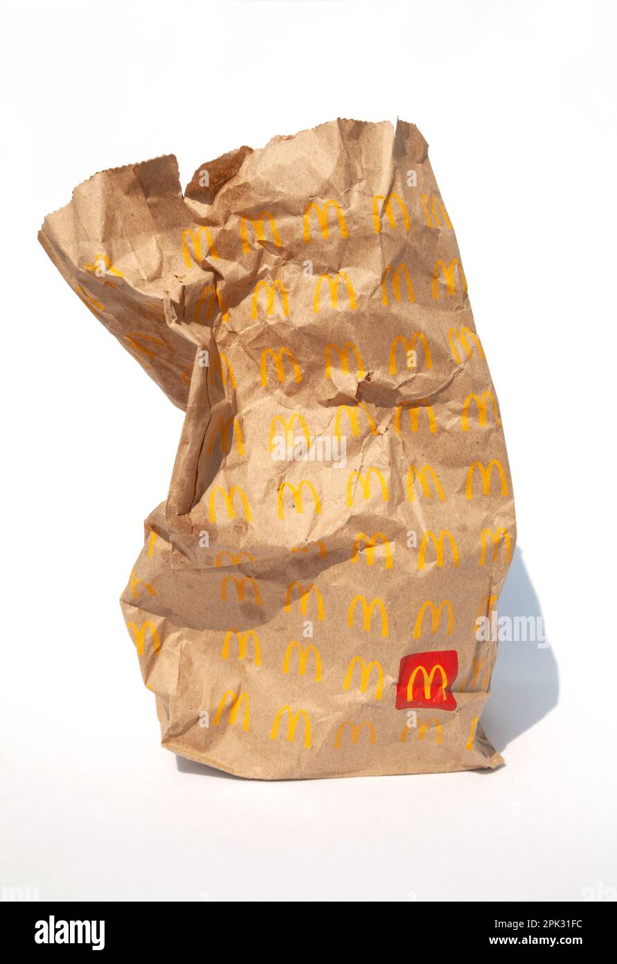 Ho Chi Minh City, Vietnam - March 30, 2023: Empty brown paper bag with McDonalds logo isolated on white. Trash left after eating in a famous fast food Stock Photo