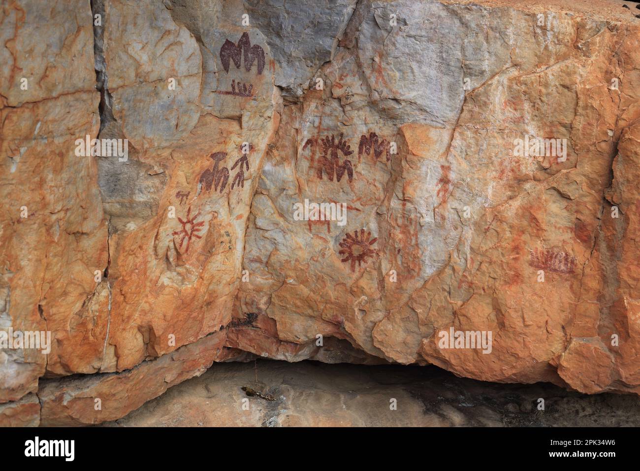 An aged rock featuring prehistoric paintings Stock Photo - Alamy