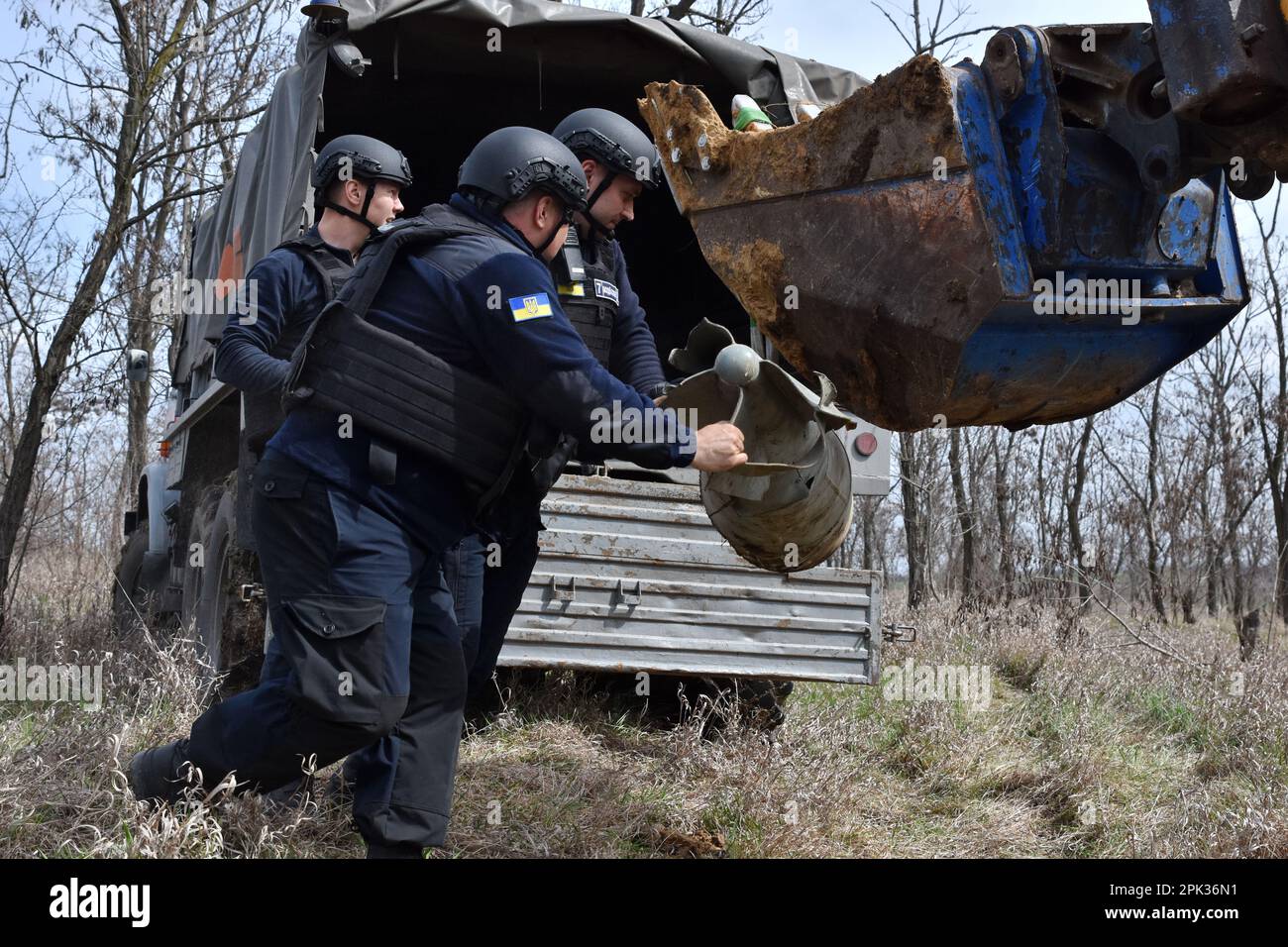 Ukrainian State Emergency Service workers remove a FAB-500 unexploded Russian air bomb that was transported from Preobrazhenka village for the controlled explosion. Ukraine needs $37.4 billion to carry out humanitarian demining of its lands, the country's Prime Minister Denys Shmyhal said on April 4, citing an assessment by the World Bank. This sum includes more than $397 million needed just for the current year, according to Shmyhal. According to the Ukrainian official, the EU, the U.S., Canada, and Japan are leaders in supporting the humanitarian demining of Ukraine's lands. (Photo by Andriy Stock Photo