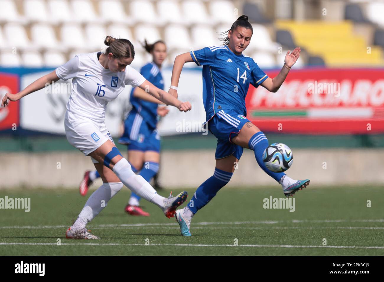 Vercelli, Italy, 5th April 2023. Anastasia Ferrara of Italy attempts to block a clearance from Athanasia Tsaroucha of Greece during the UEFA U19 Championship match at Stadio Silvio Piola, Vercelli. Picture credit should read: Jonathan Moscrop / Sportimage Stock Photo