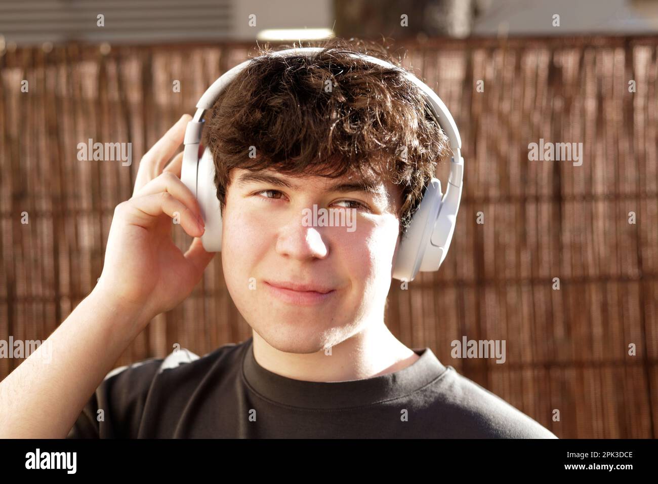 boy with headphones looking at camera Stock Photo