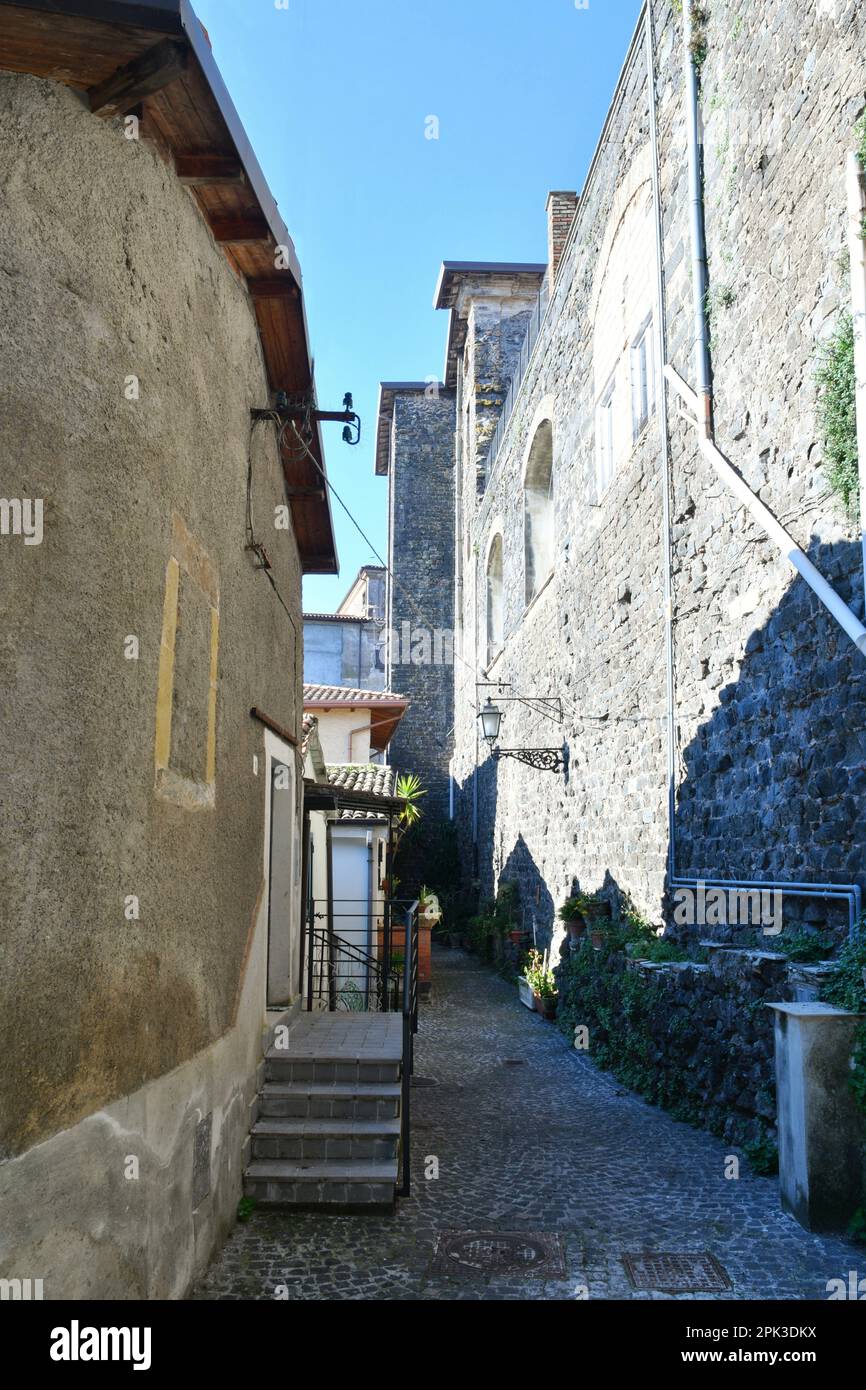 A narrow street among the old houses of Pofi, a medieval town in the ...