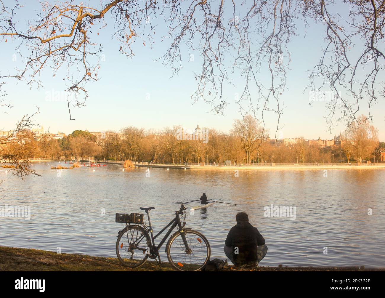 rowing and cycling in the last hours of the day in Madrid, the capital ...