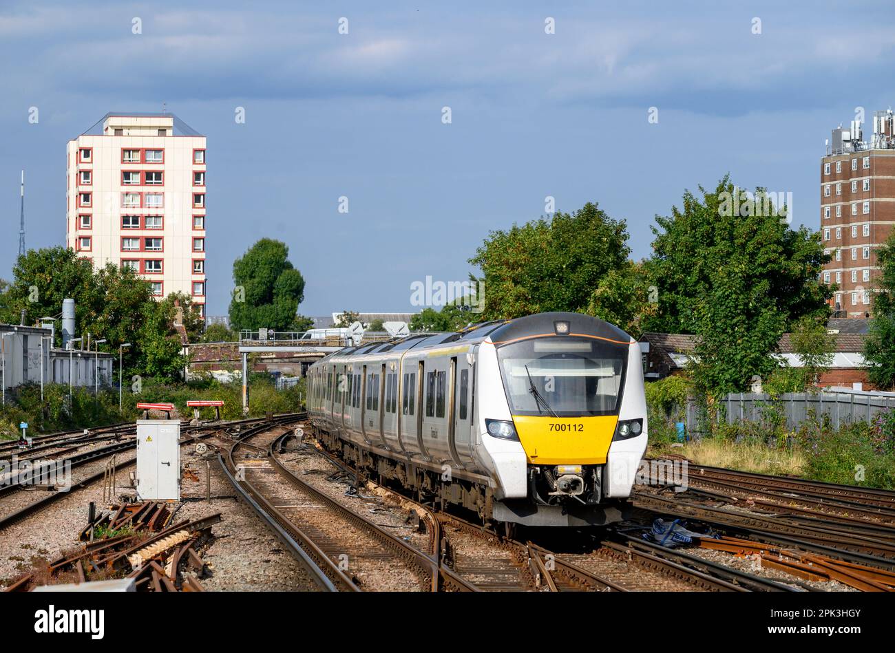 Class 700 passenger train in Thameslink livery travelling along track, London, England. Stock Photo