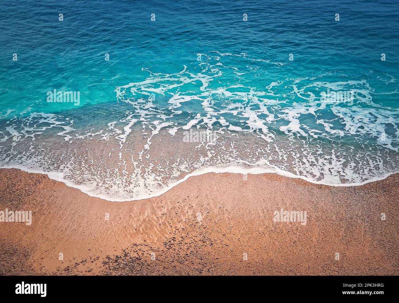 Blue ocean waves hits the shoreline. Beautiful texture of turquoise sea  water and golden sandy beach. Tropical summer seaside background Stock  Photo - Alamy