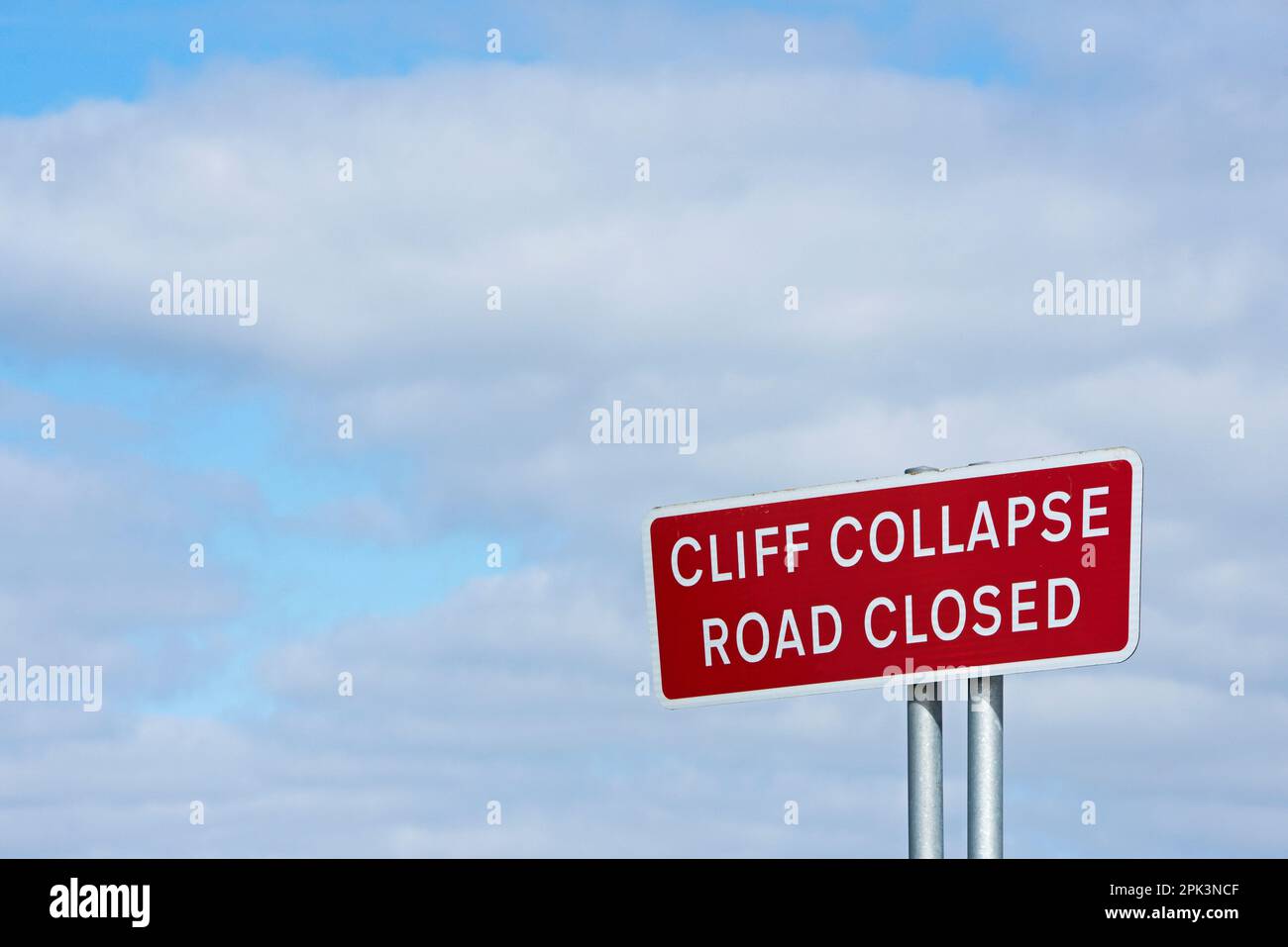 Sign warning of cliff erosion near Skipsea, East Yorkshire, England UK Stock Photo