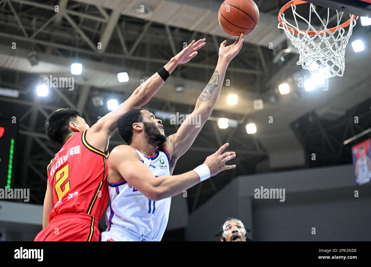 Tianjin. 5th Apr, 2023. Quinndary Weatherspoon (R) of Tianjin Pioneers goes for a lay-up during the 42nd round match between Tianjin Pioneers and Shenzhen Leopards at 2022-2023 season of the Chinese Basketball Association (CBA) league in north China's Tianjin, April 5, 2023. Credit: Zhao Zishuo/Xinhua/Alamy Live News Stock Photo