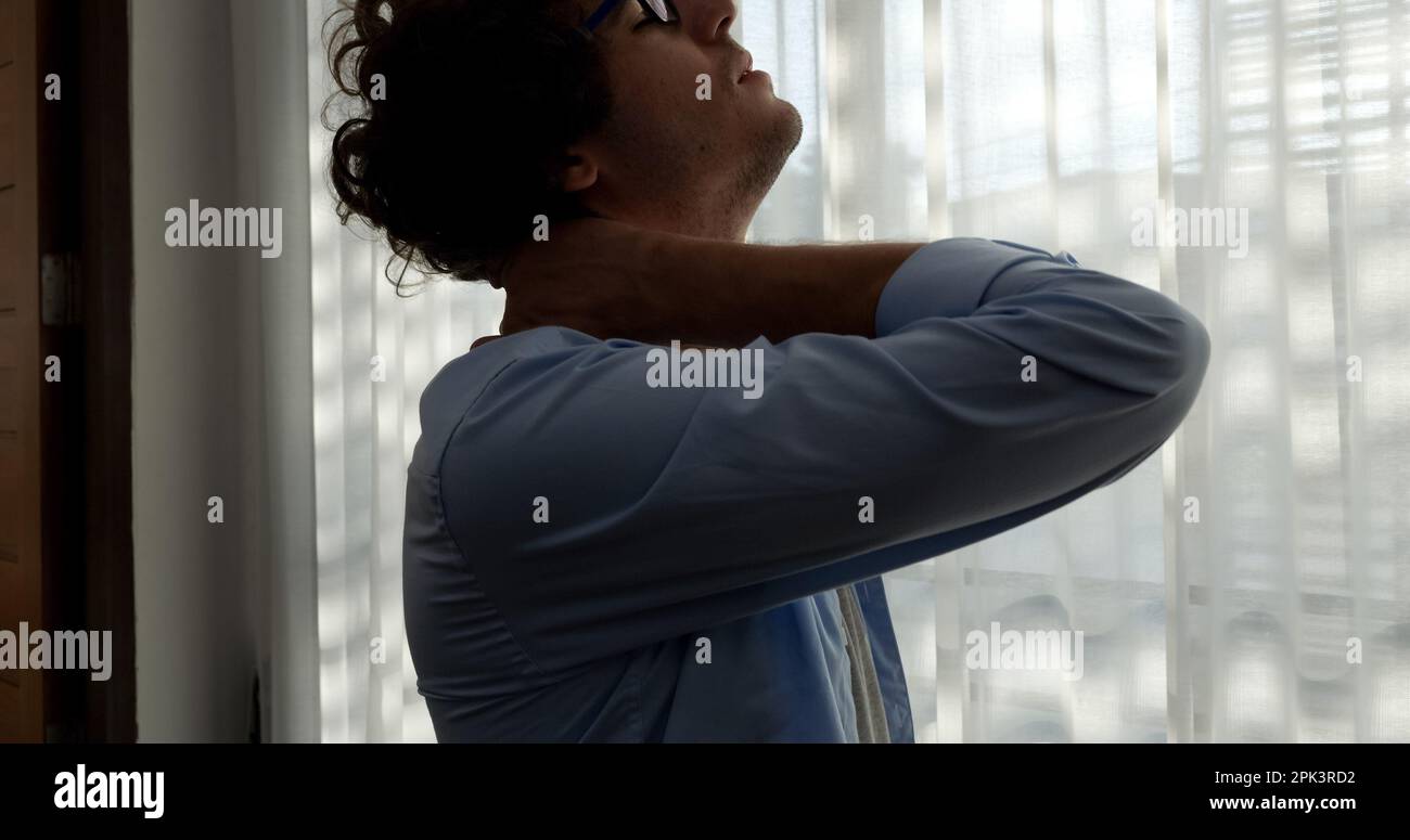 Tired businessman massaging neck in hi-res stock photography and images ...