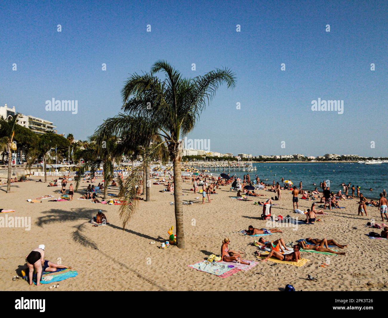 Cannes beach people sunbathing Stock Photo
