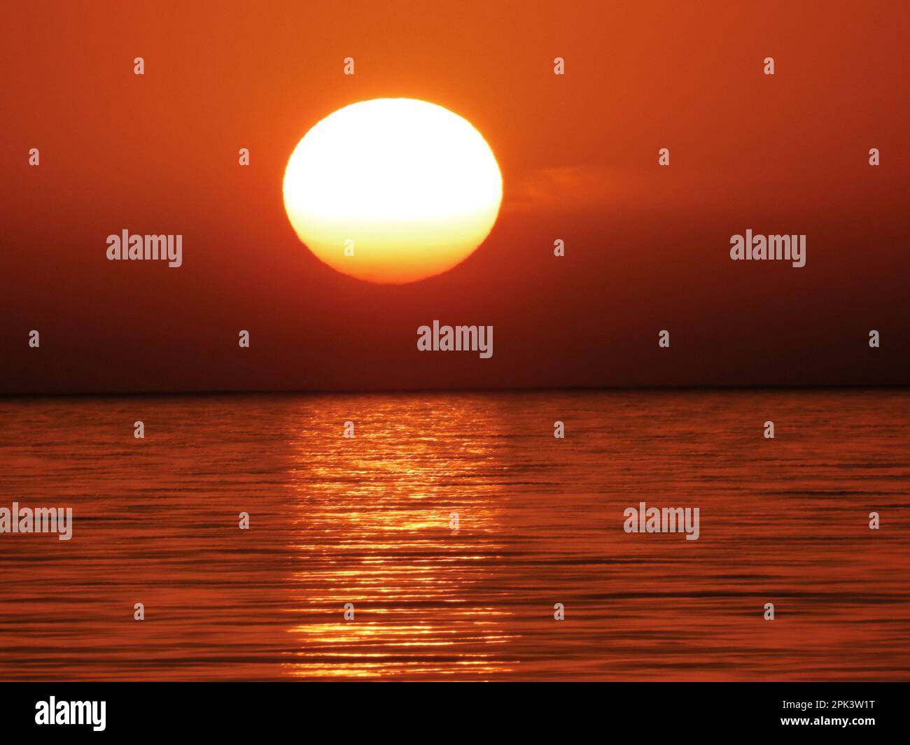 Vivid sunset sky reflecting over hi-res stock photography and images ...