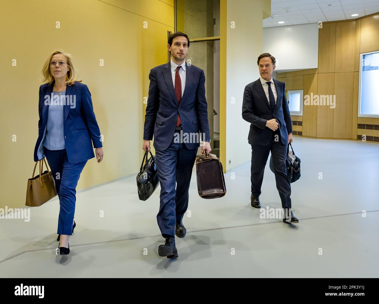 THE HAGUE - Sigrid Kaag, Minister of Finance, Wopke Hoekstra, Minister of  Foreign Affairs, and Prime Minister Mark Rutte walk away during a  suspension of the debate in the House of Representatives