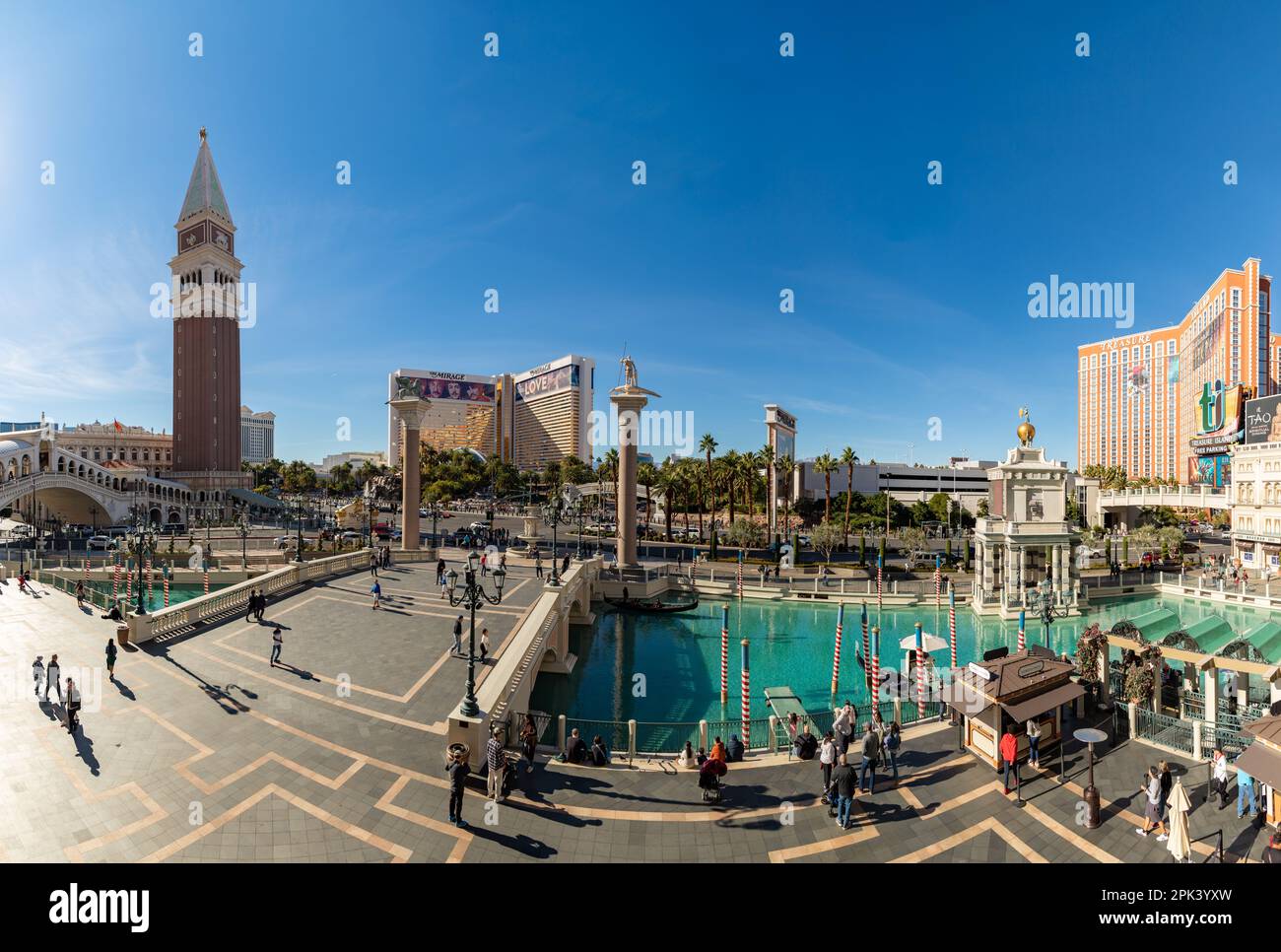 A picture of the Venetian Las Vegas, with the Campanile Tower and the Mirage on the left, and the pond on the right. Stock Photo