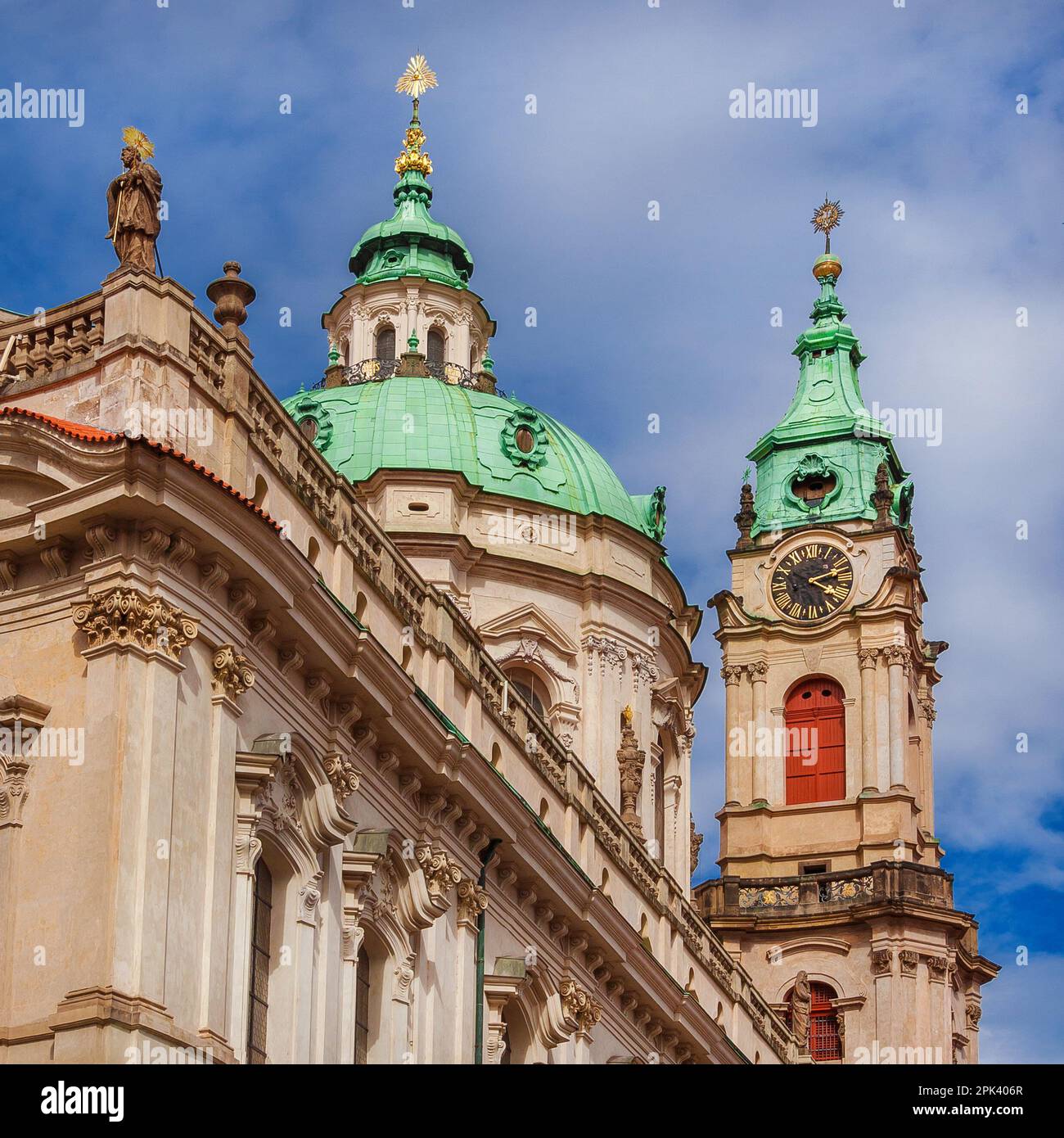 Baroque art and architecture in Prague. Church of Saint Nicholas beautiful dome and clock tower erected in 18th centuty in Mala Strana district Stock Photo