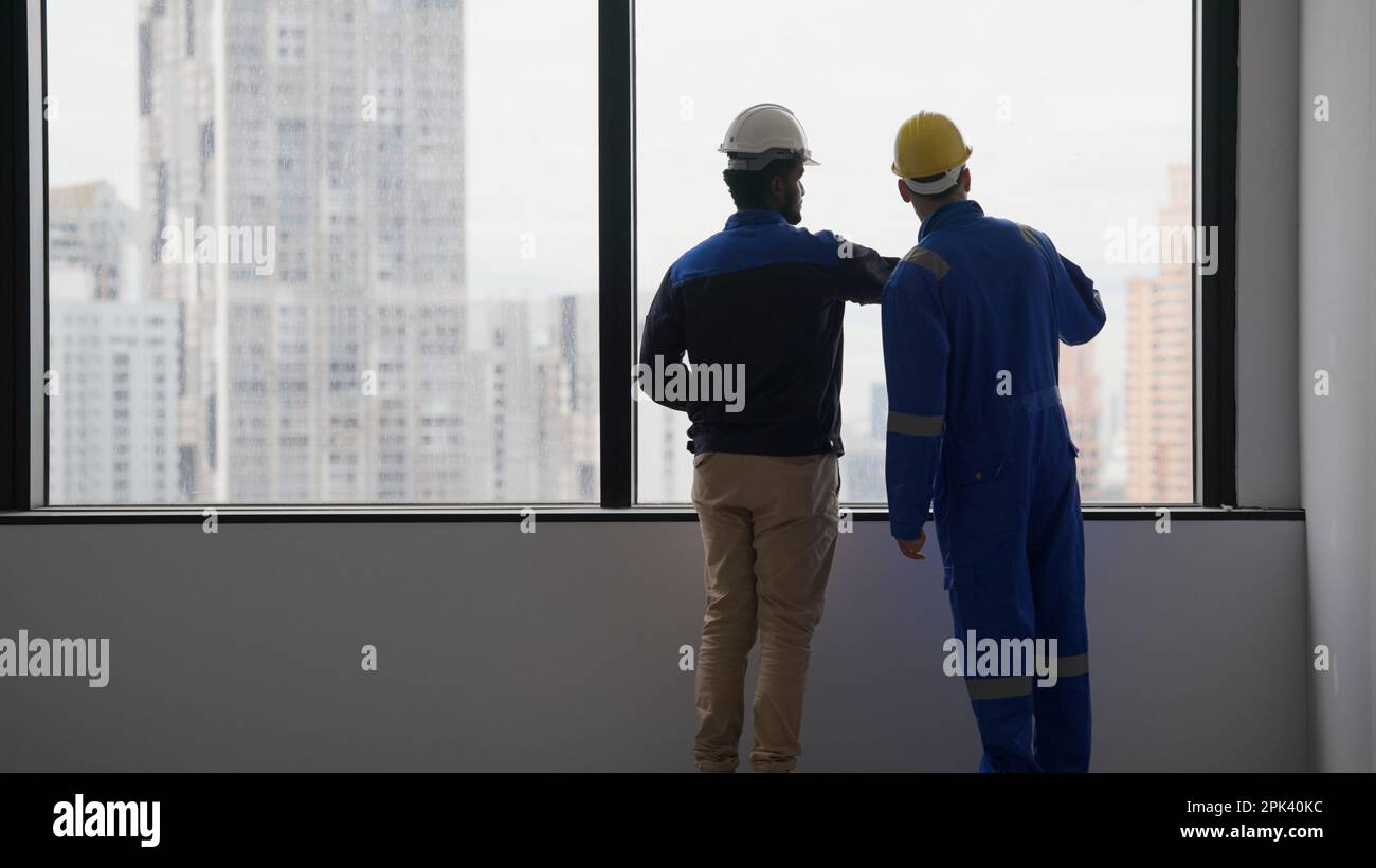 Professional construction workers using tablet brainstorming and planing Stock Photo