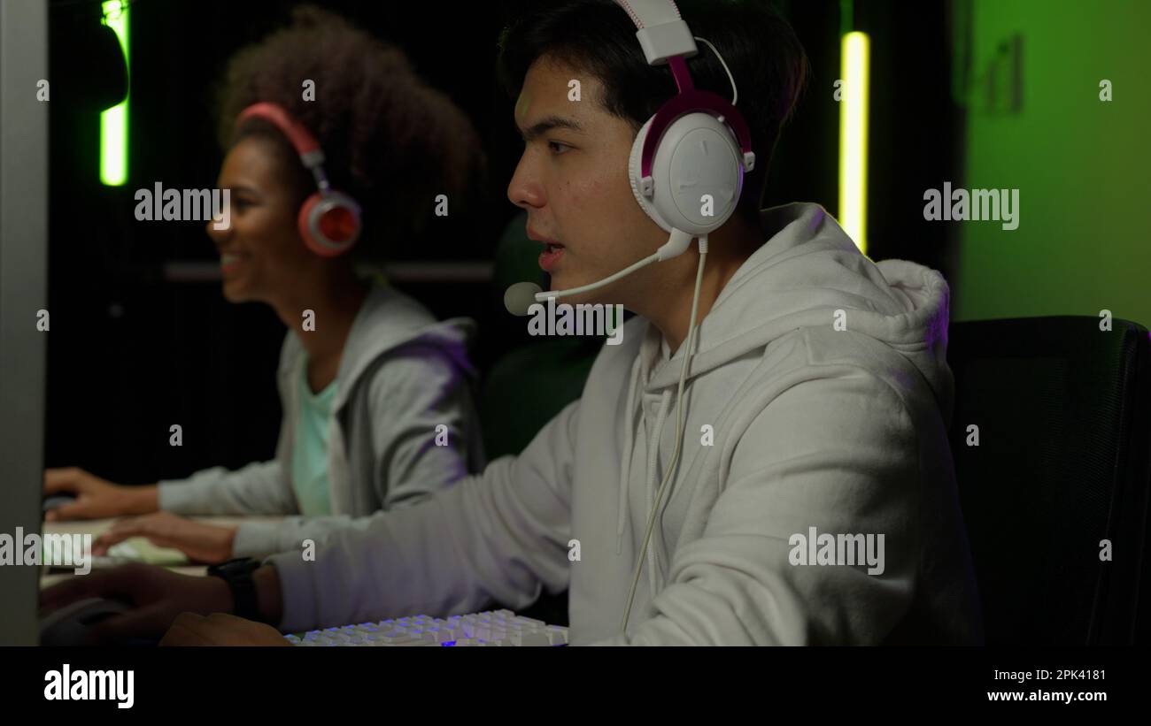 Premium Photo  Person streaming video games online with live chat. player  using headphones and microphone on computer, to play gameplay on live  stream. man broadcasting game with equipment at desk.