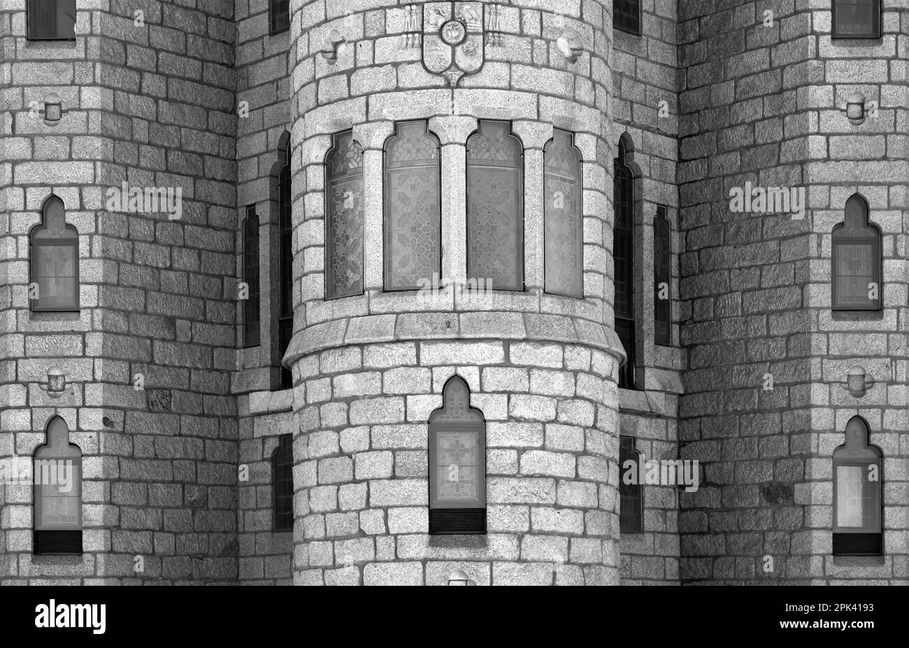 Shot in color and black and white detail on the facade of this historic building representing some character, animal or flower. Set at Astorga Stock Photo