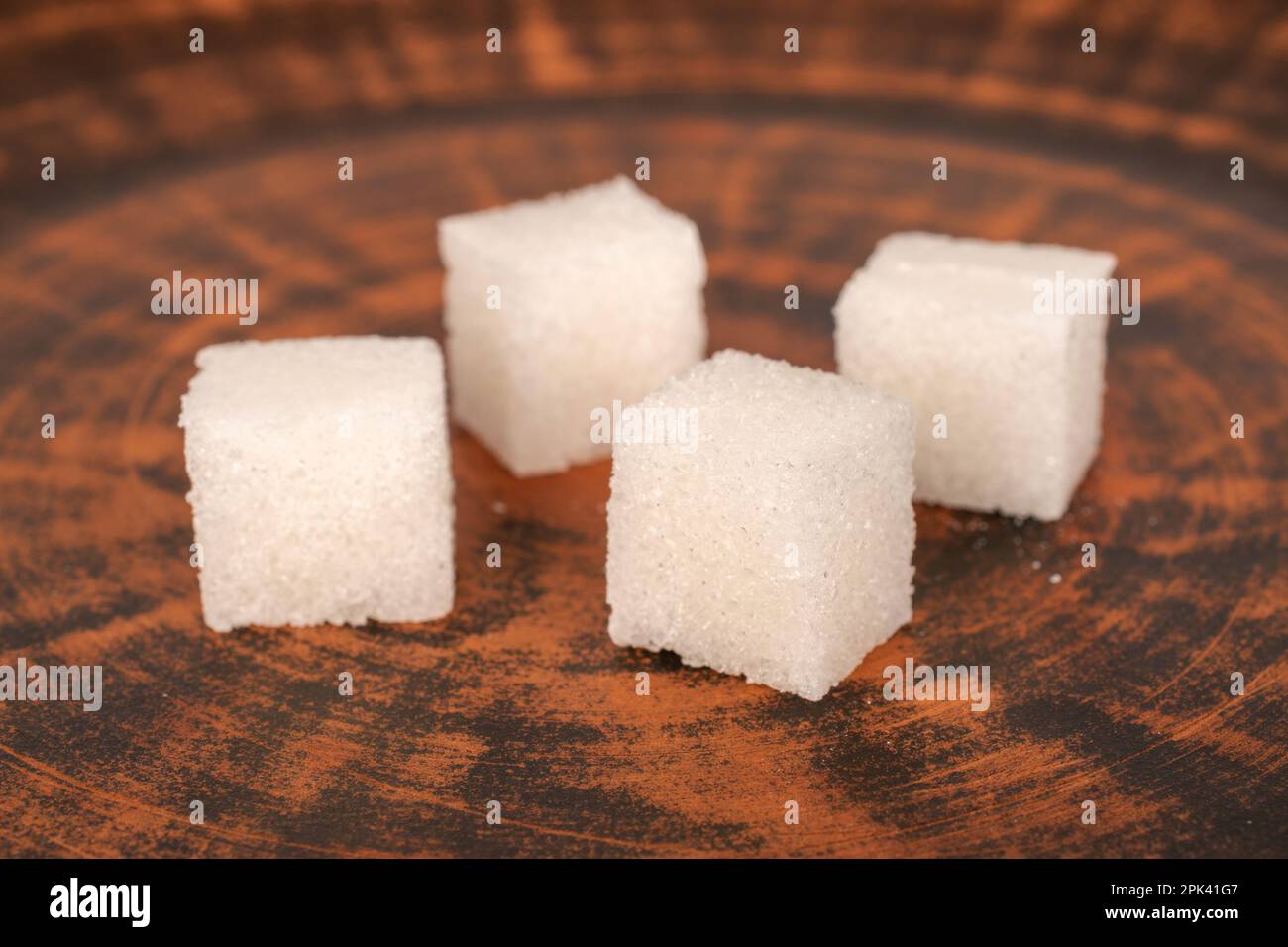 A few cubes of white sugar on a clay dish, macro Stock Photo - Alamy