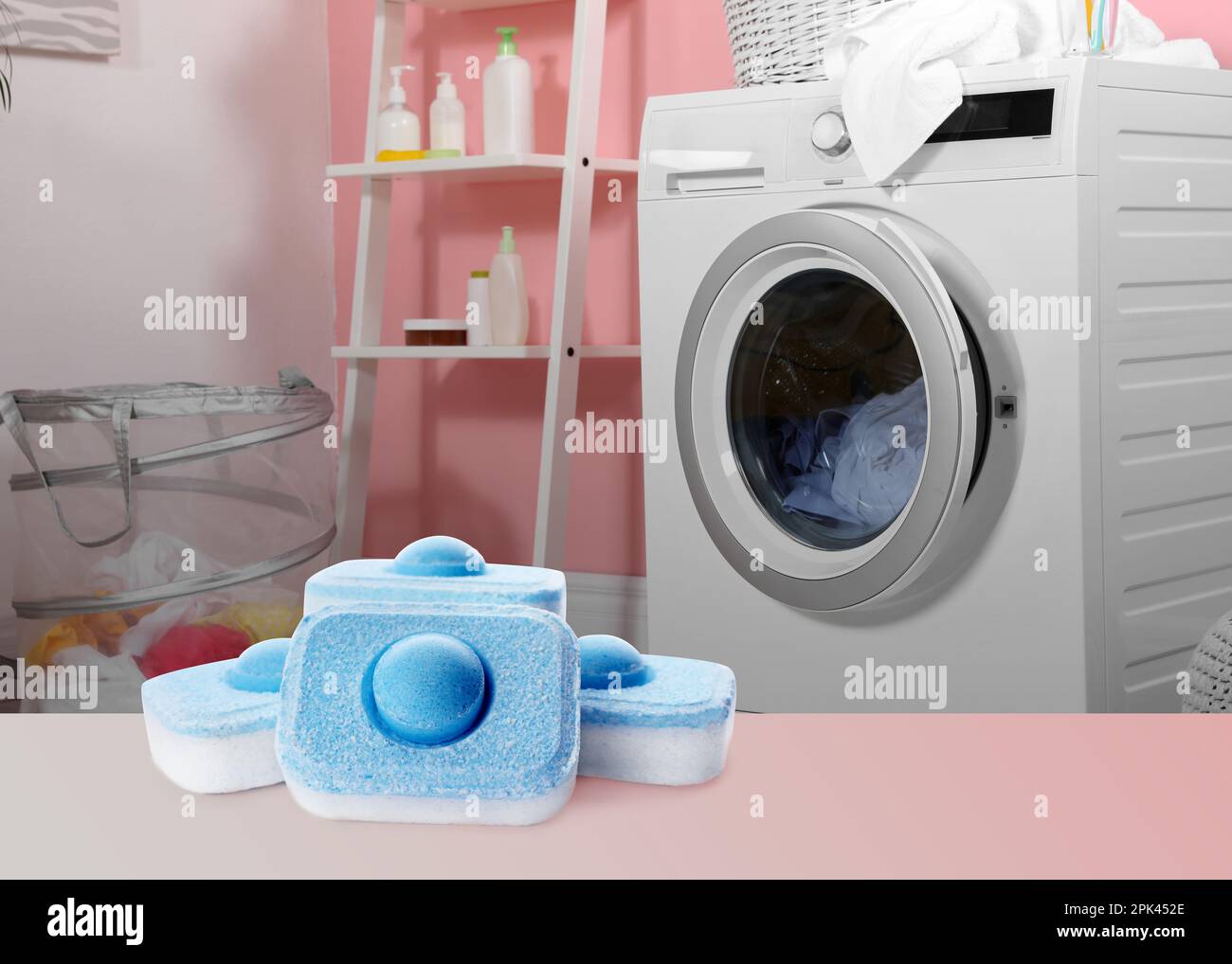 Image of water softener tablets and modern washing machine in laundry