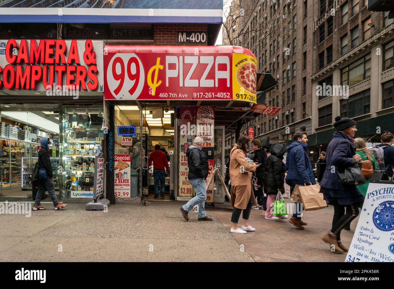 https://c8.alamy.com/comp/2PK458R/hungry-pizza-lovers-eat-at-a-99-cent-pizzeria-in-midtown-manhattan-in-new-york-on-friday-march-31-2023-richard-b-levine-2PK458R.jpg