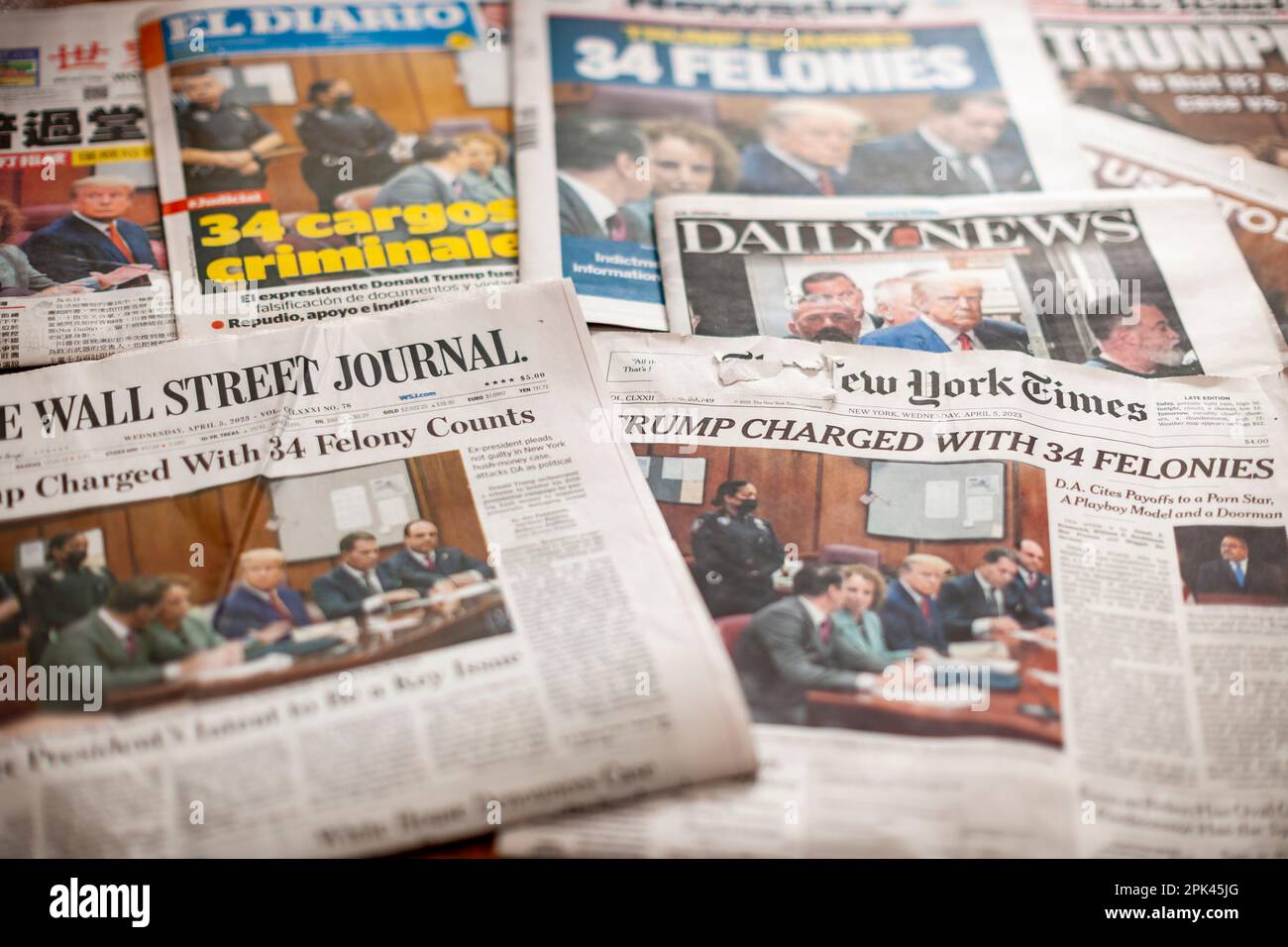Newspapers in New York on Wednesday, April 5, 2023 report on the previous day’s arraignment of former President Donald Trump, being charged with 34 felonies over the alleged payment of hush money to Stormy Daniels. (© Richard B. Levine) Stock Photo