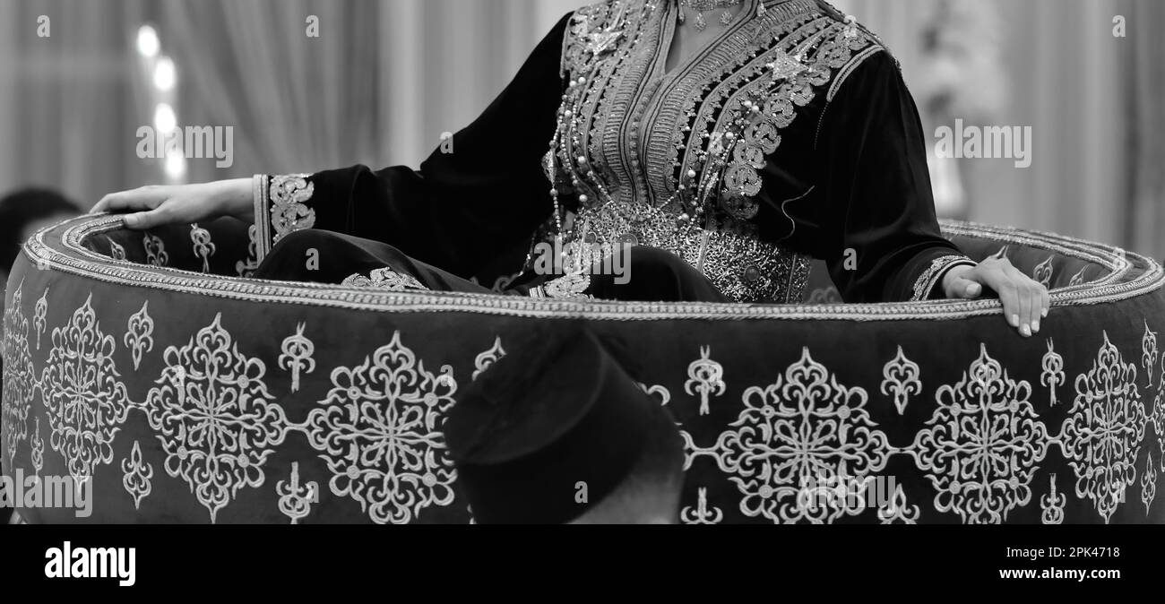 Beautiful bride dressed in Moroccan caftan, on the Amaria , celebrating her wedding - Marakesh Stock Photo