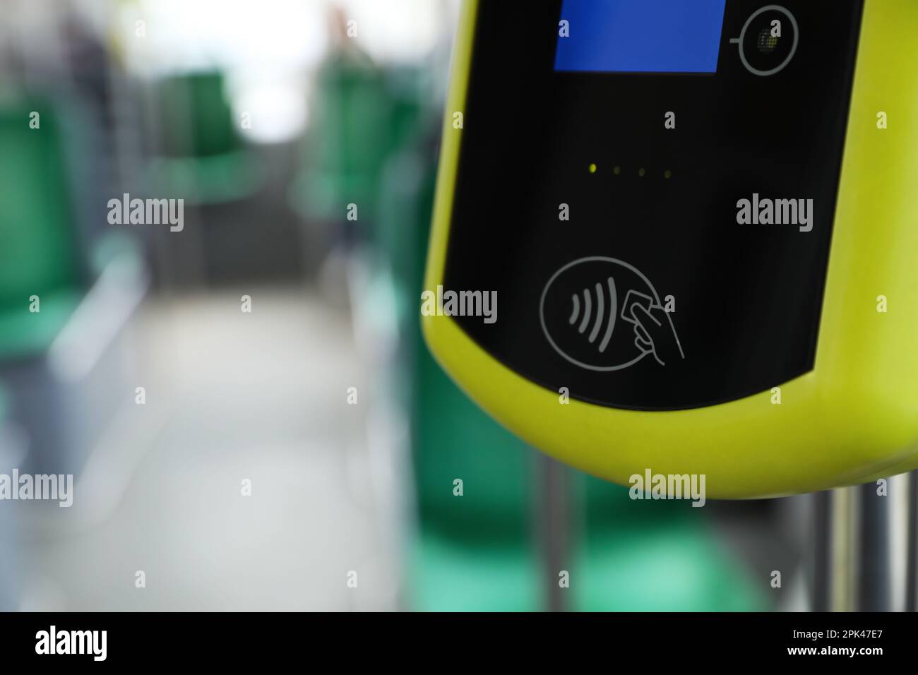 Contactless fare payment device in public transport, closeup. Space for text Stock Photo