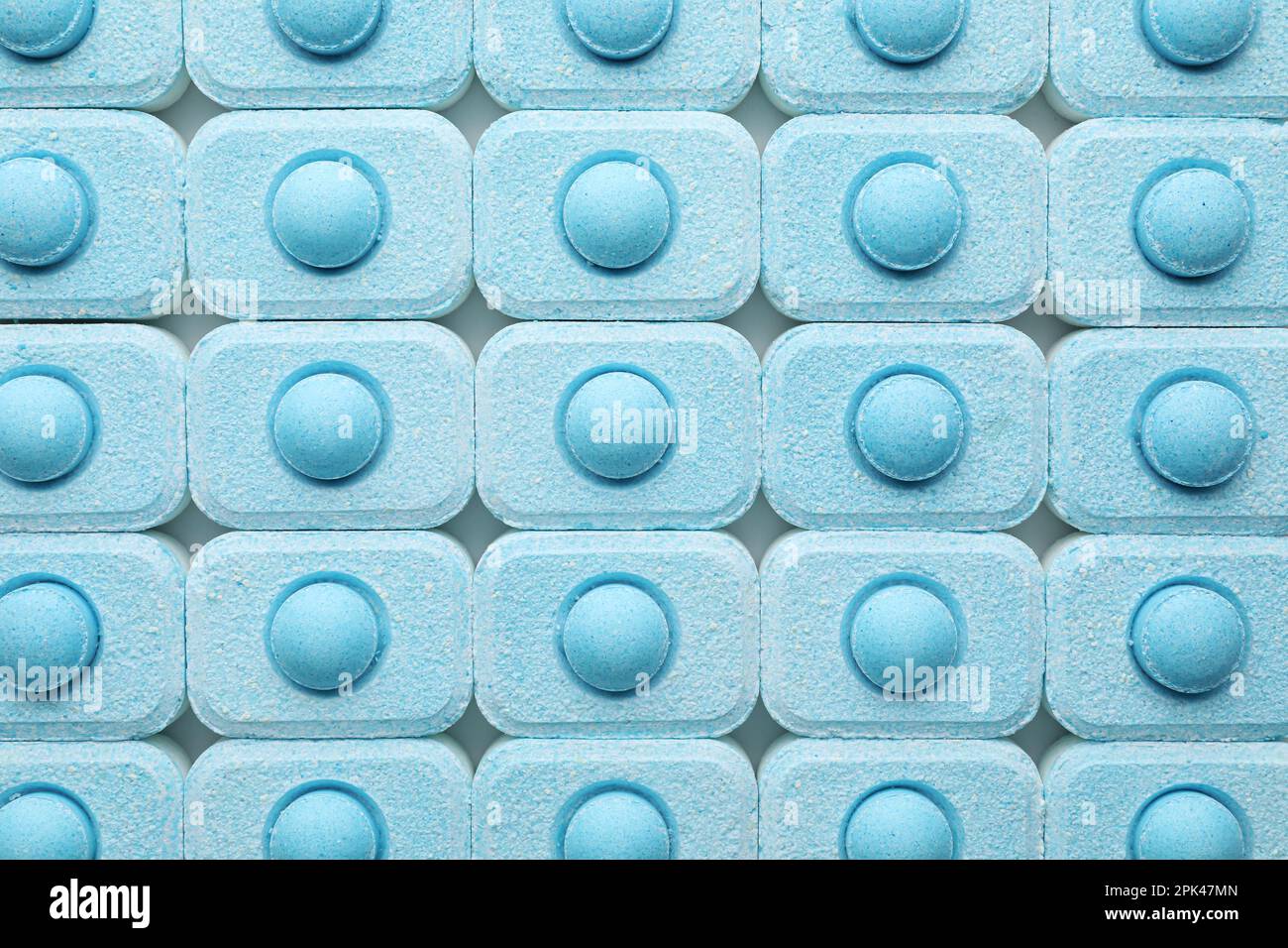 Many water softener tablets as background, top view Stock Photo