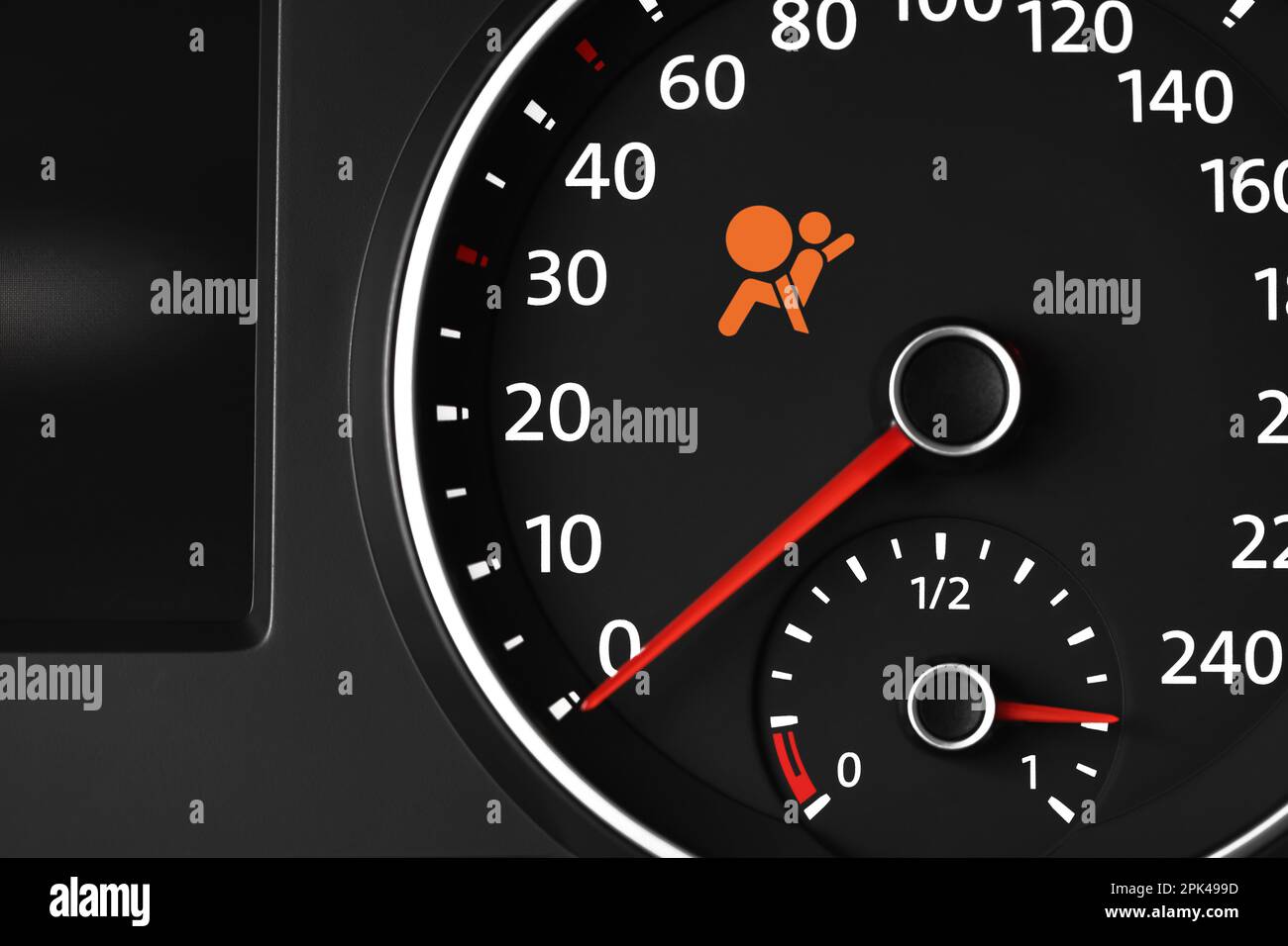 Closeup view of dashboard with warning icon check airbag system in car