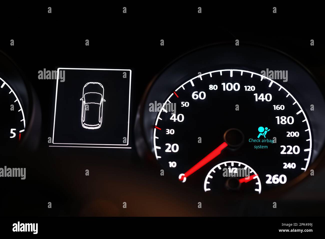 Closeup view of dashboard with warning icon check airbag system in car