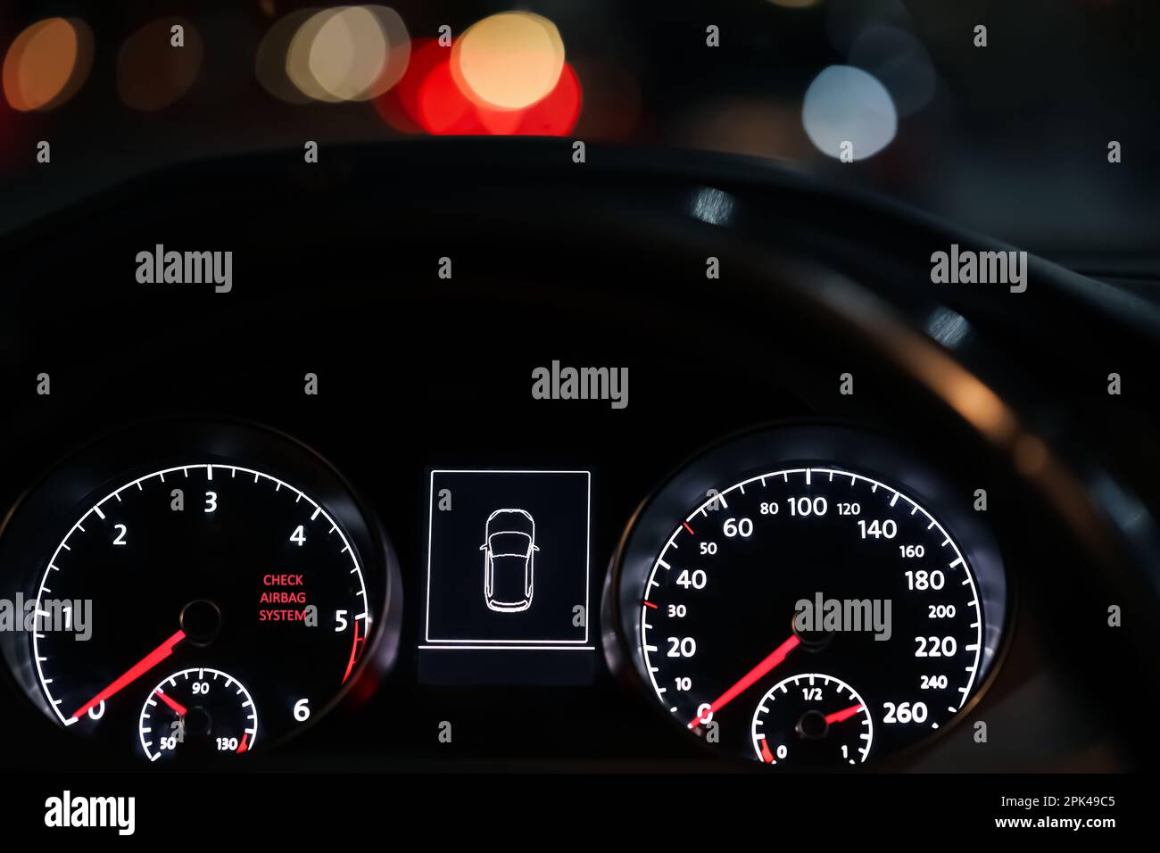 Closeup view of dashboard with warning icon check airbag system in car