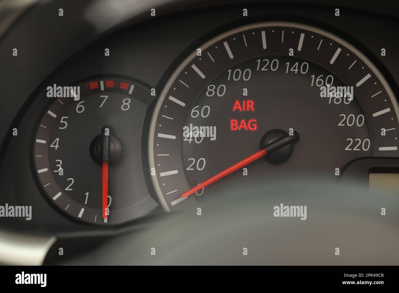 Closeup view of dashboard with warning icon check airbag system in car