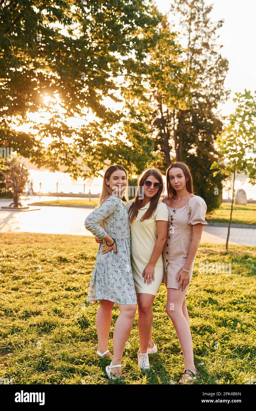 Three adults standing together hi-res stock photography and images - Alamy