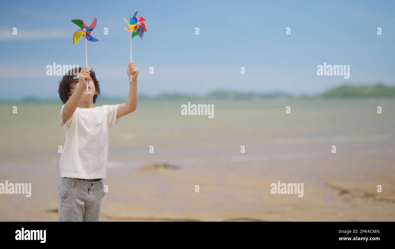 Happy asian family playing at the beach hi-res stock photography and ...